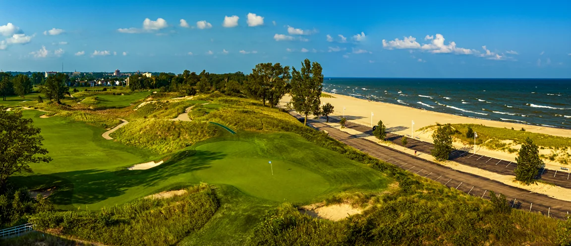 The 7th green at Harbor Shores above the Lake Michigan beach